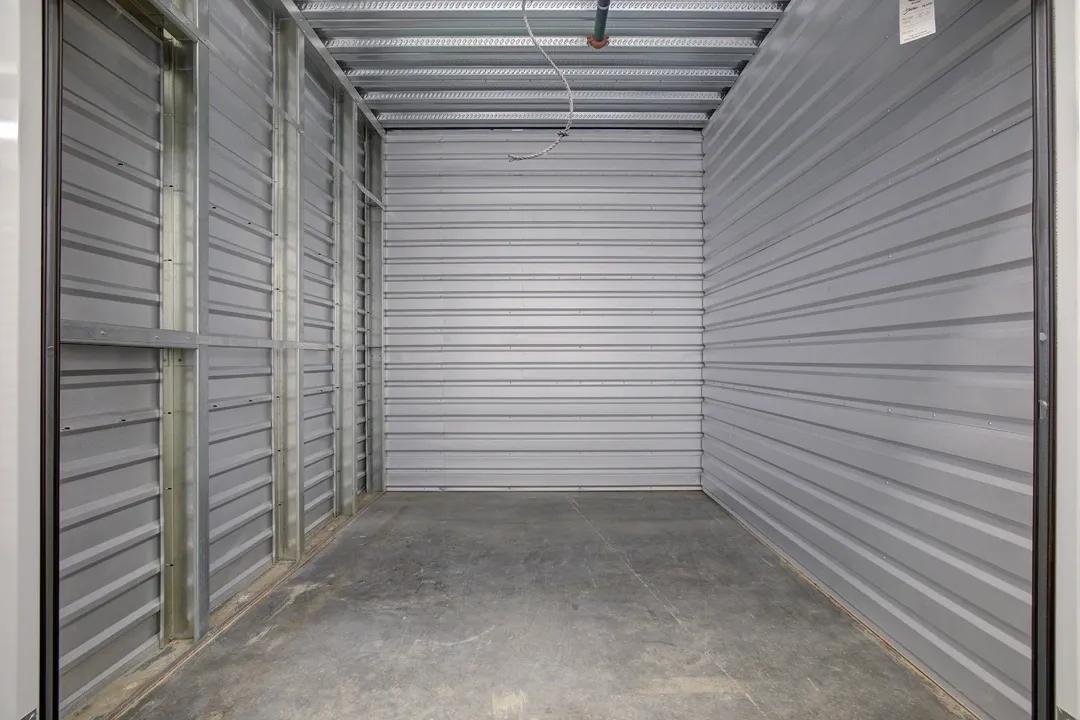 Empty storage unit with metal walls.