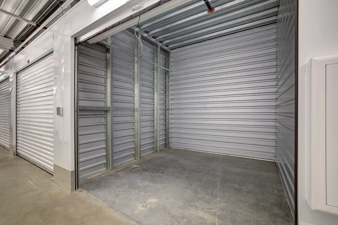 Empty storage unit with metal walls.