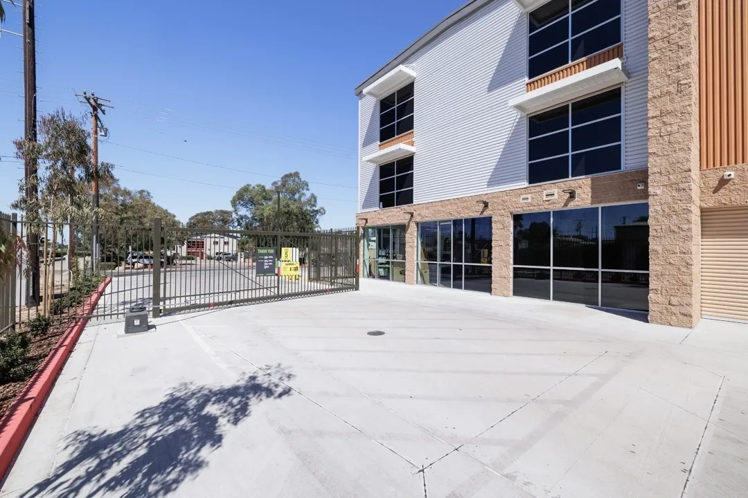 Modern building entrance with gated access.