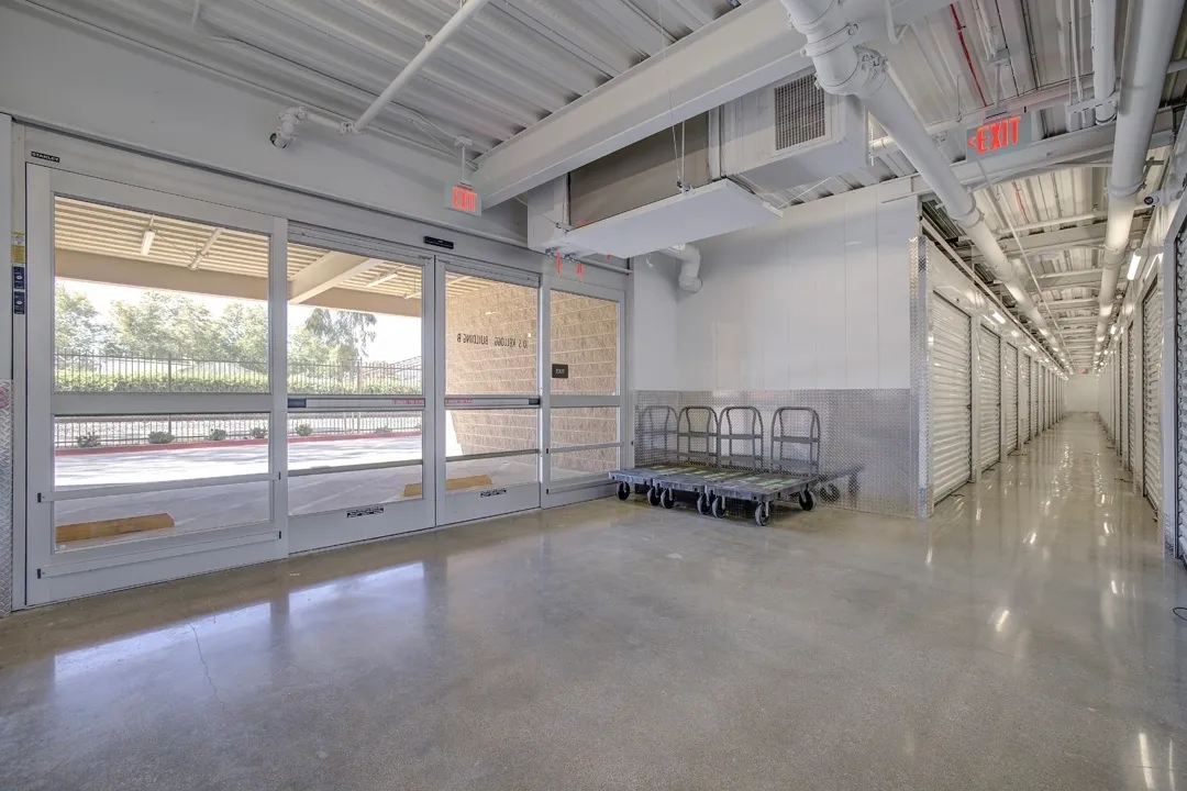 Storage facility interior with rolling carts.