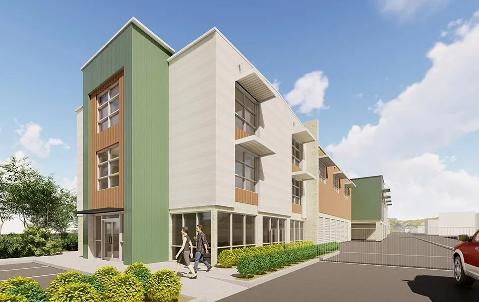 Modern multi-story building with landscaped surroundings.