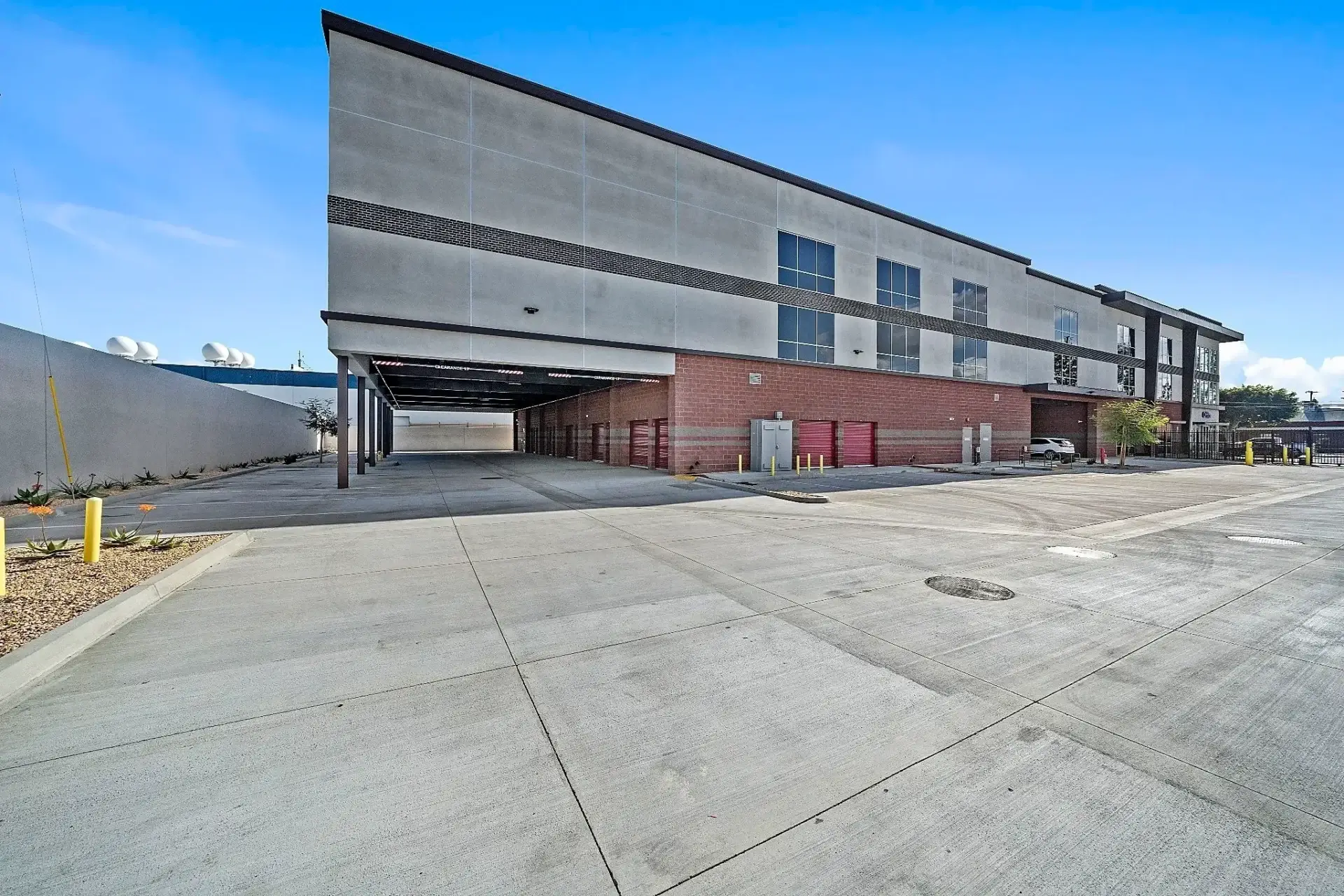 Modern building with a spacious parking area.