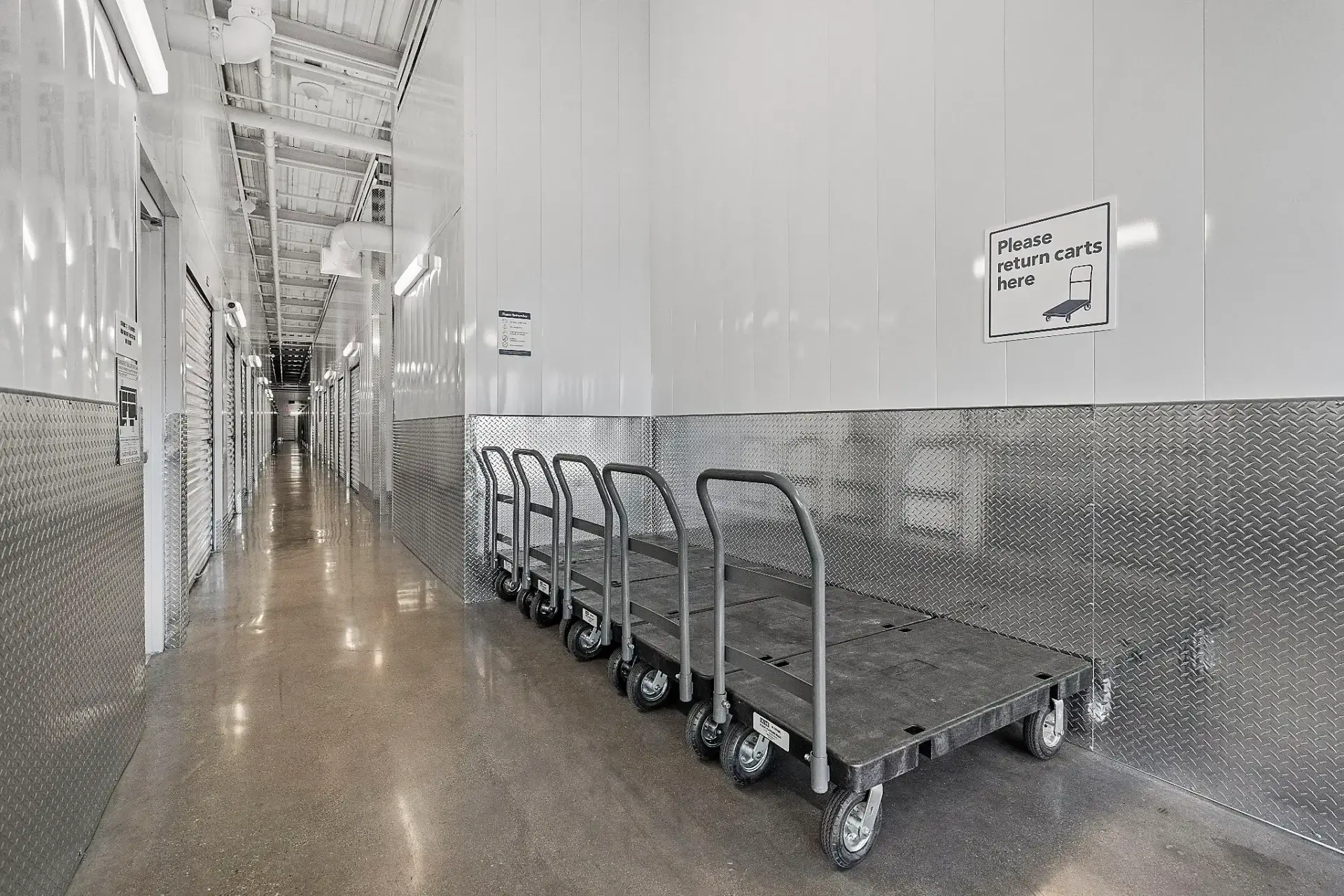Storage corridor with cart return signage.