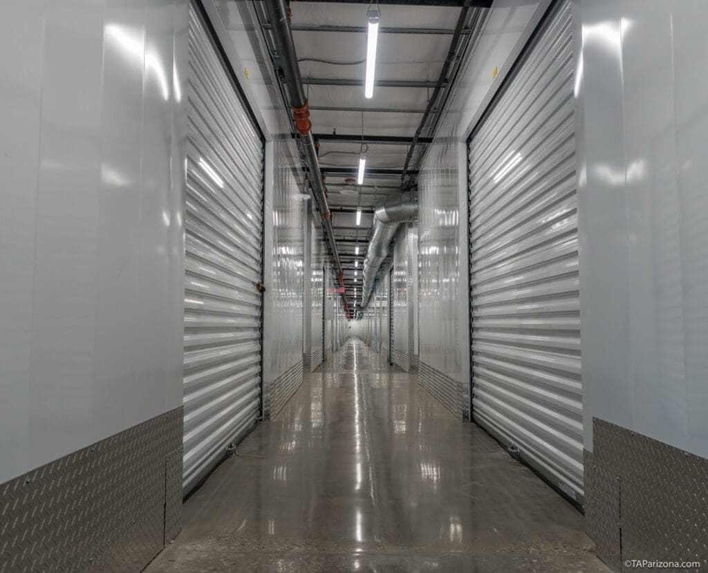 Tucson Orange Grove Self Storage photo of interior units with polished floors and white doors