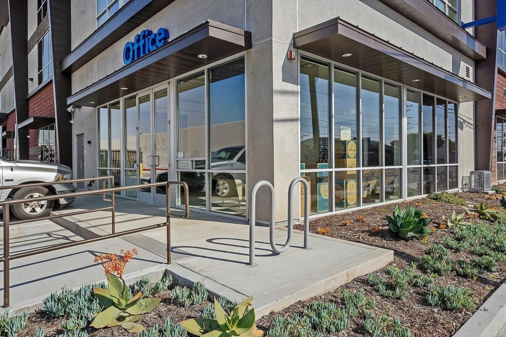 Office entrance with landscaped pathway.