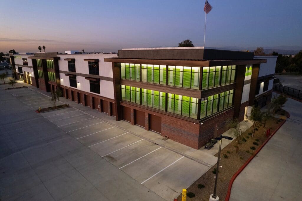 Modern building with green storage units.