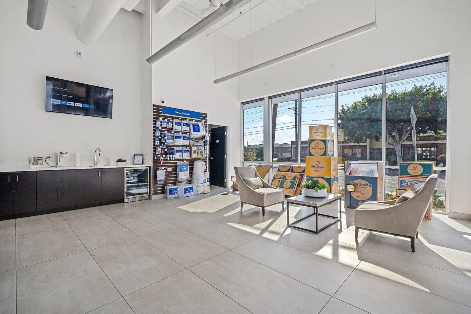 Modern office space with seating and storage boxes.