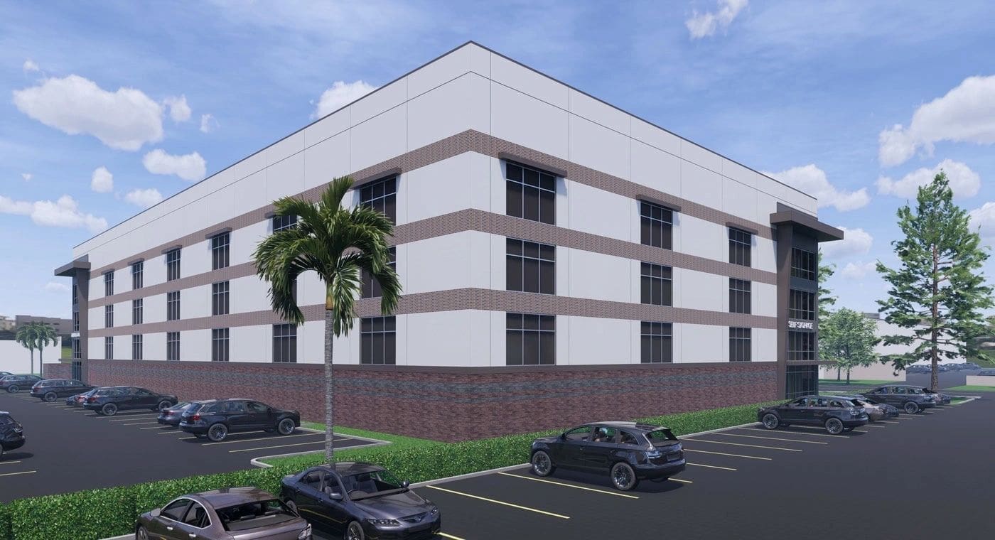 Rendering of a multi-level building with glass windows and brick accents