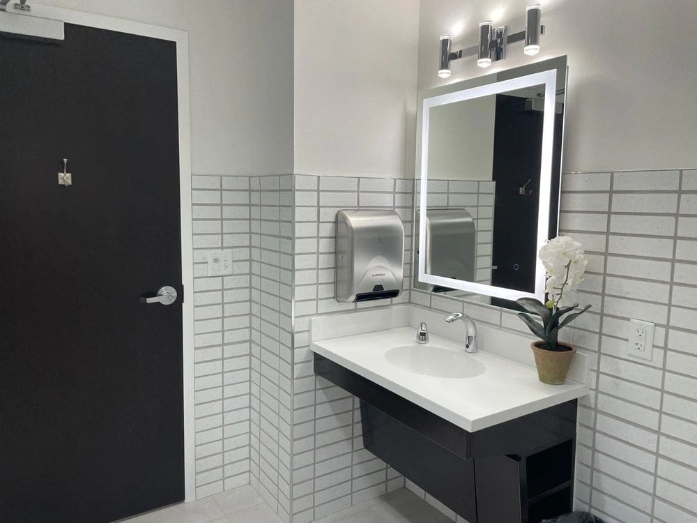 Modern bathroom with sink and mirror.