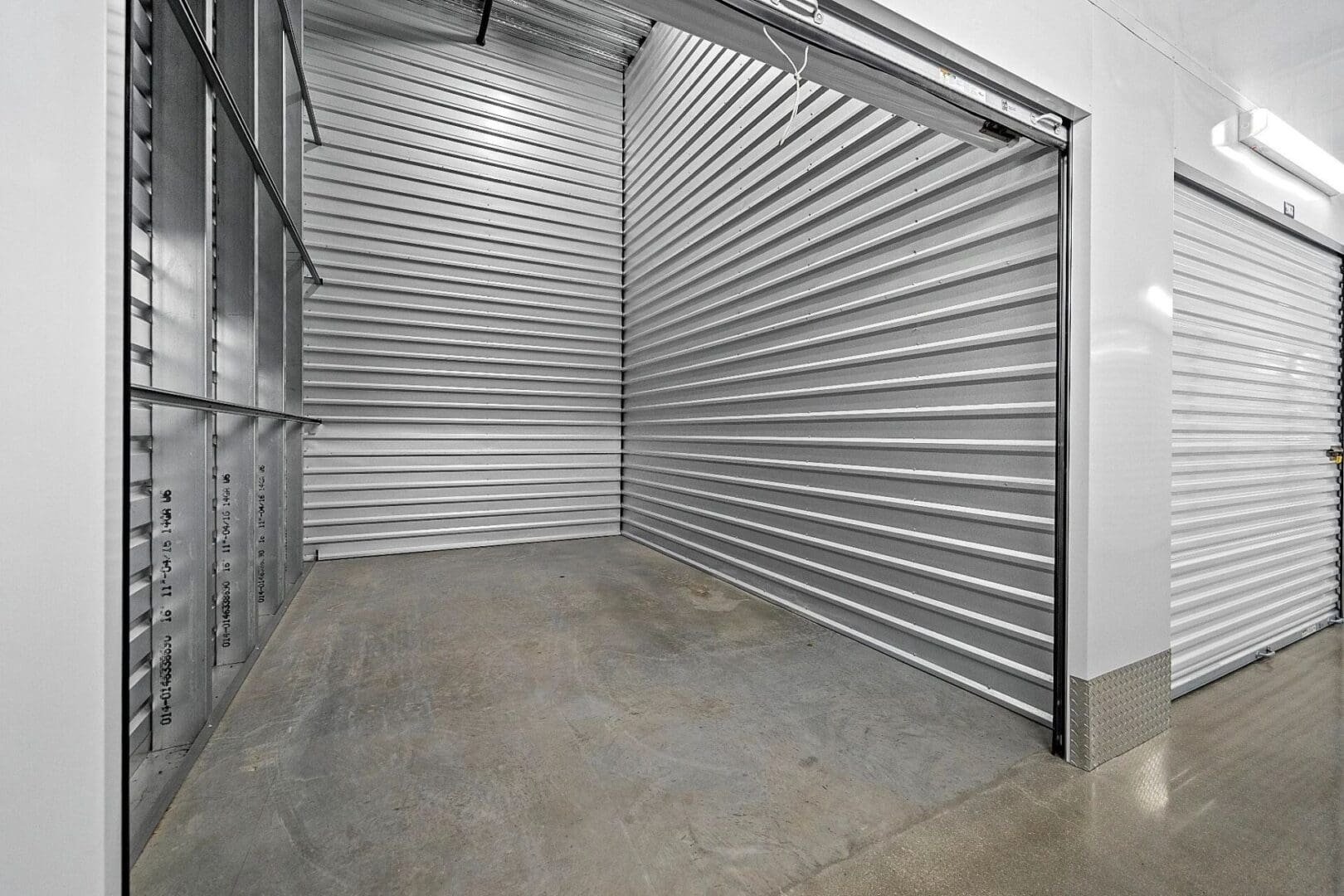 Empty storage unit with metal doors.