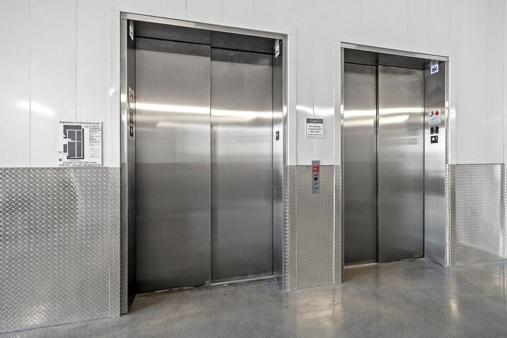 Two elevators in a modern building.