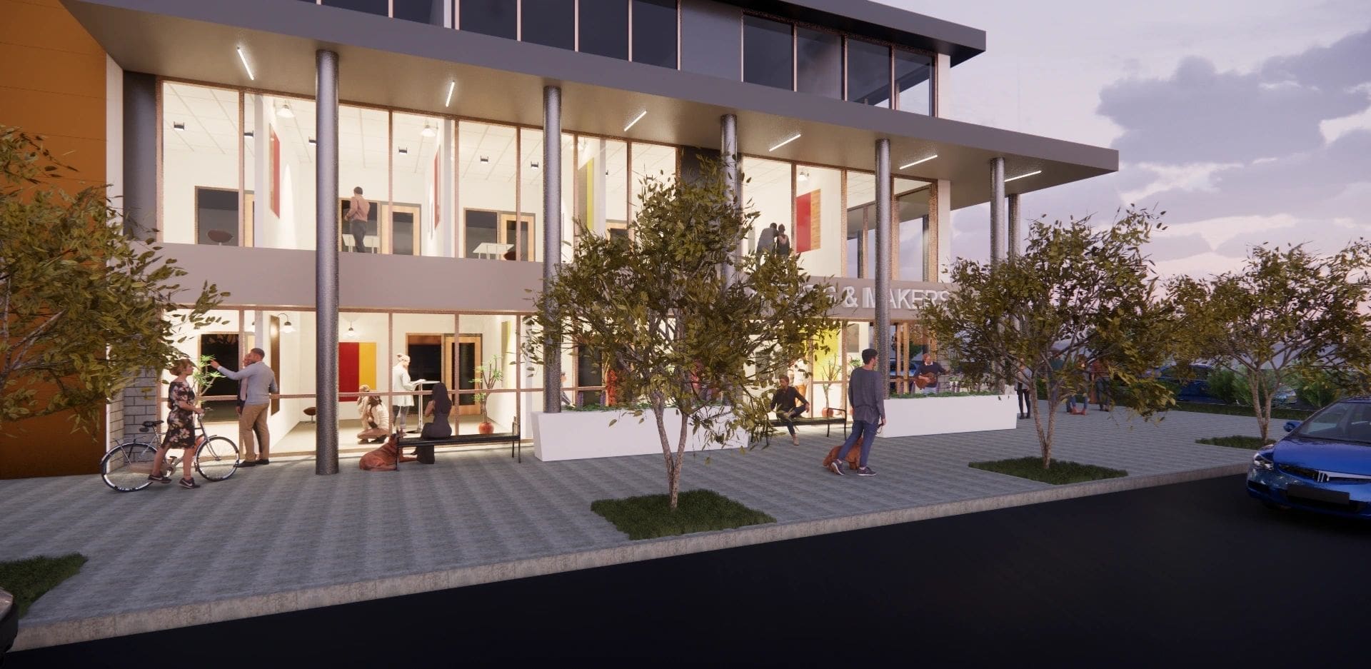 Modern building with people and greenery outside.