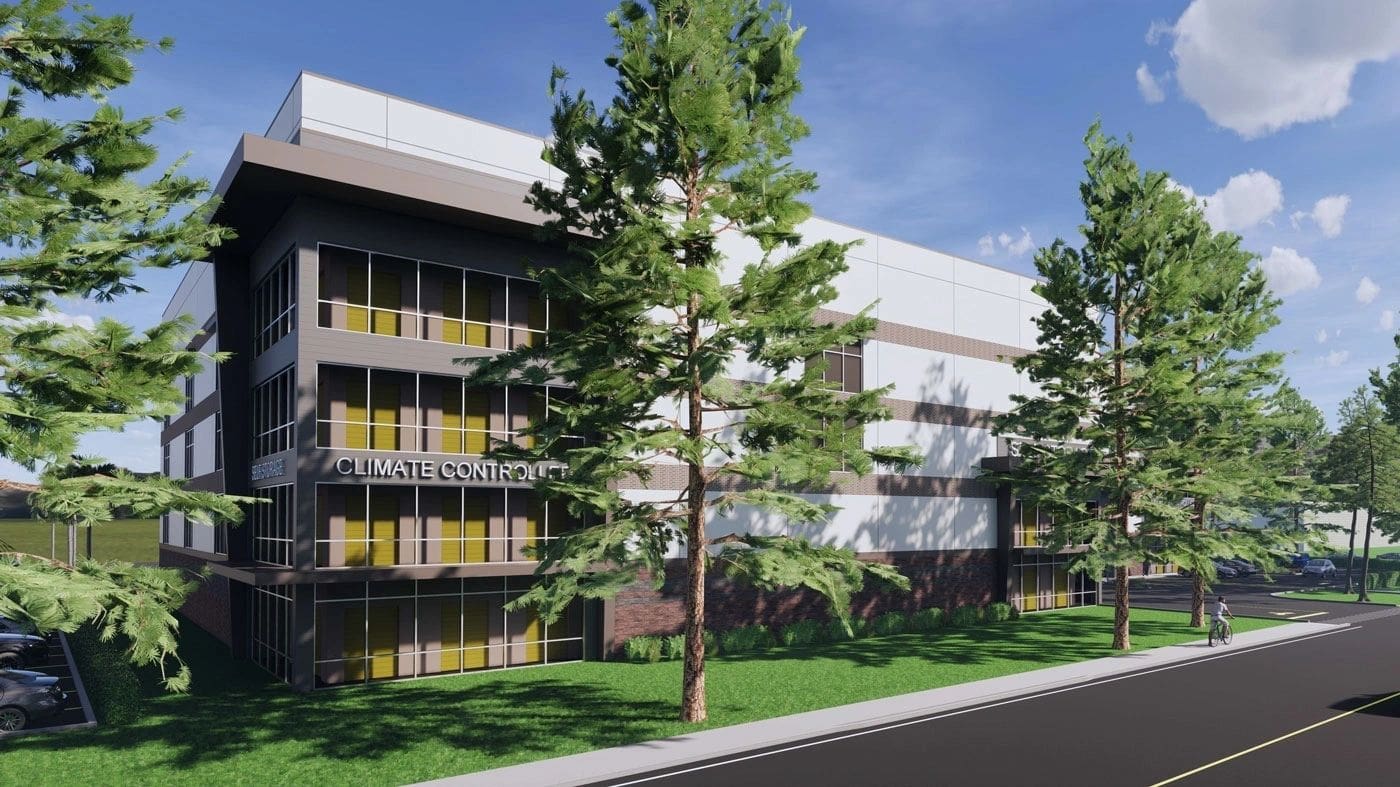 Rendering of a multi-level building with glass windows and brick accents