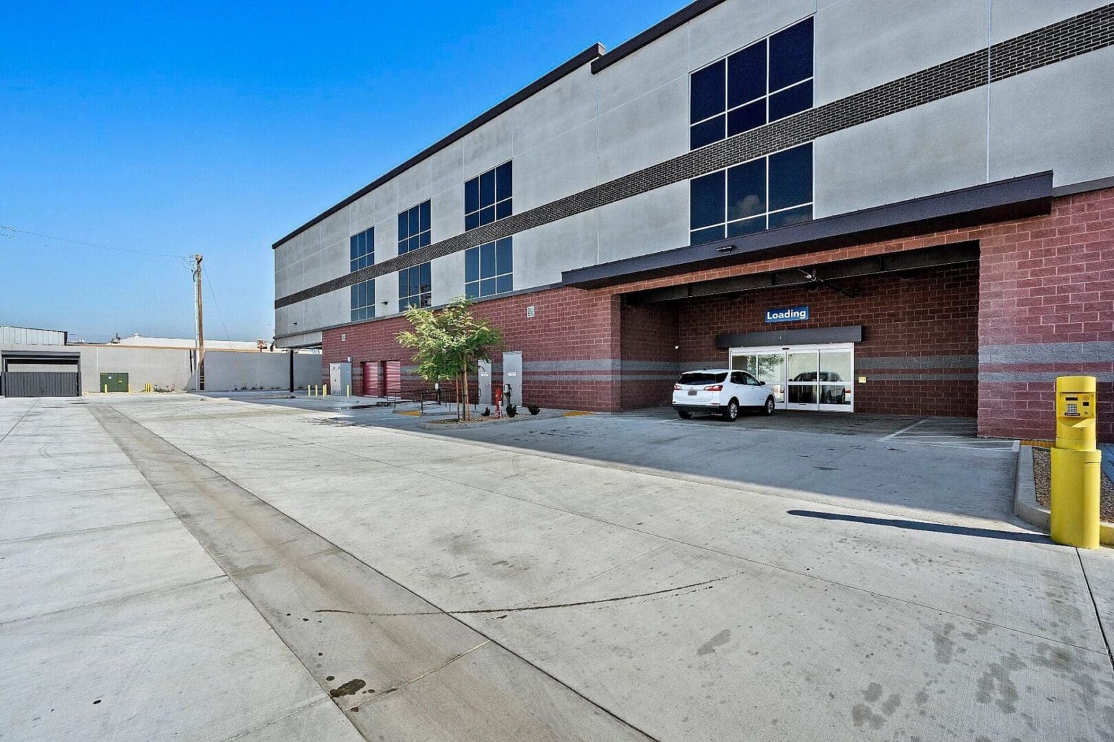 Loading dock area with a parked vehicle.
