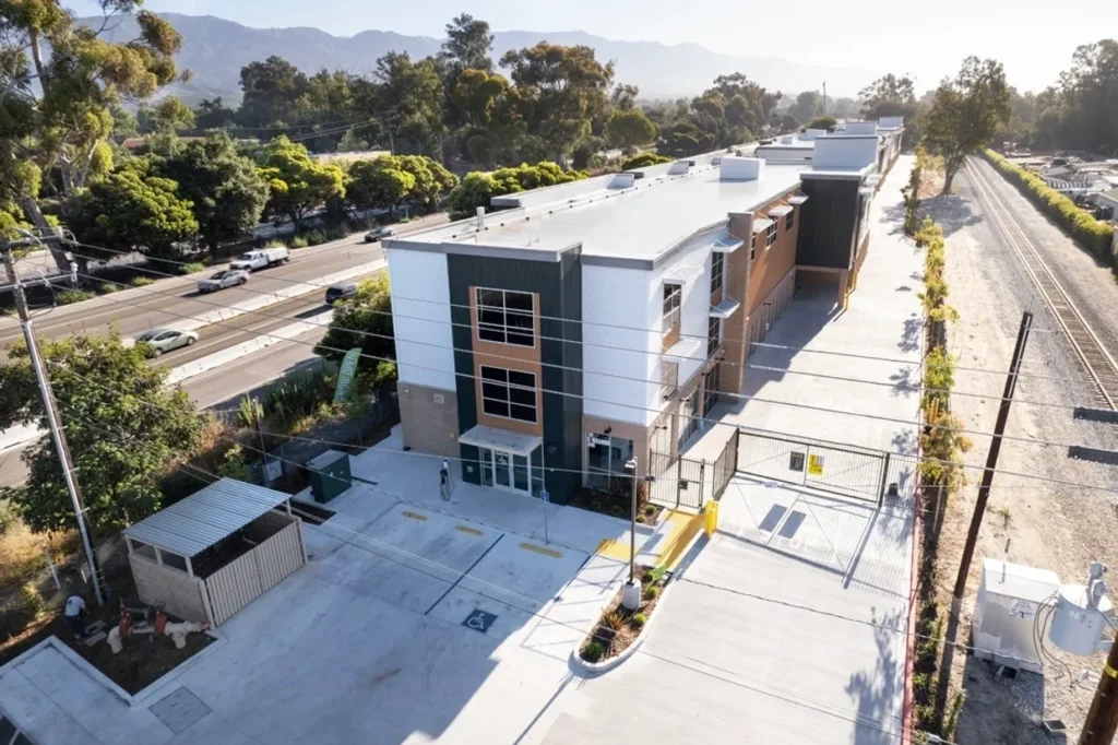 Modern building with parking and landscaping.