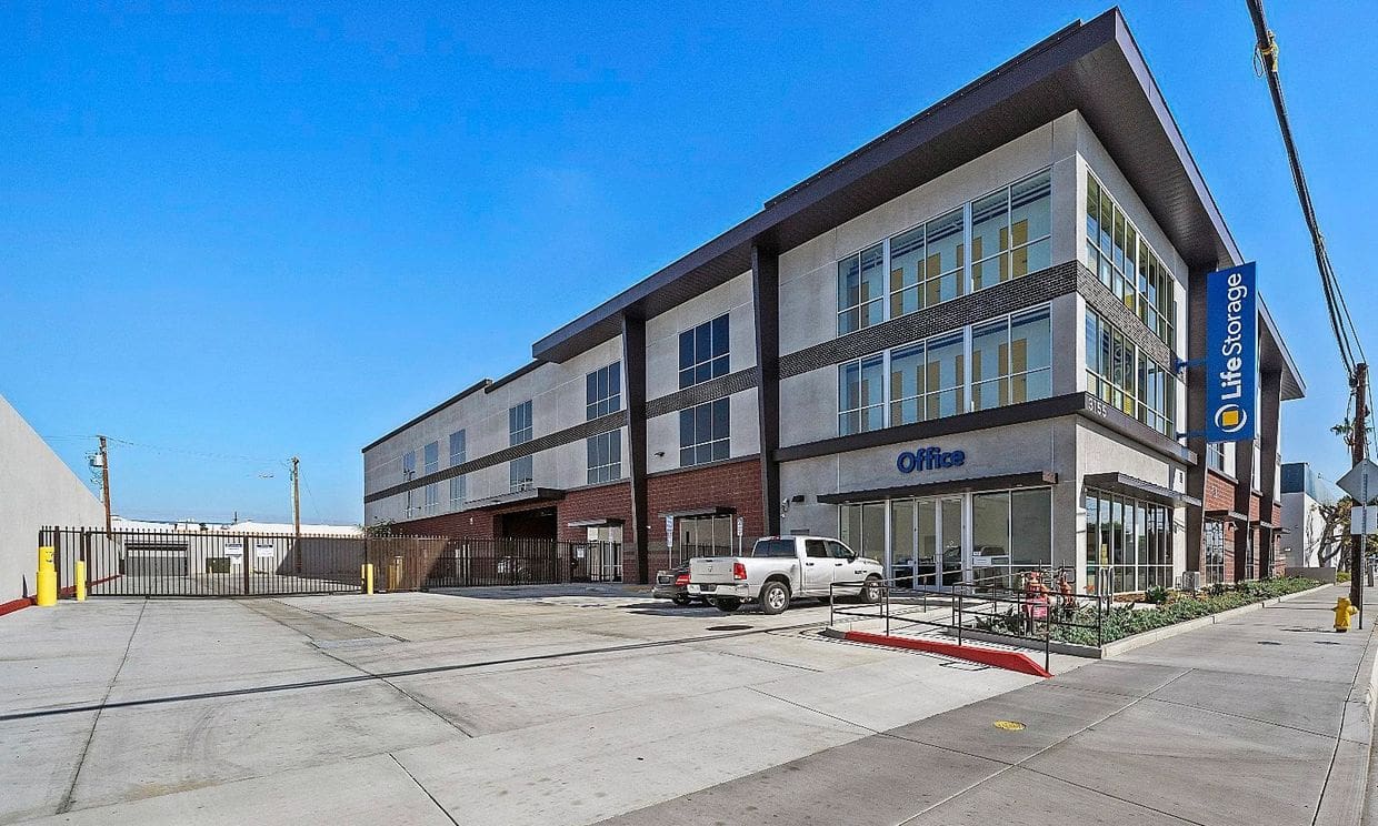 Modern storage facility with parking area.