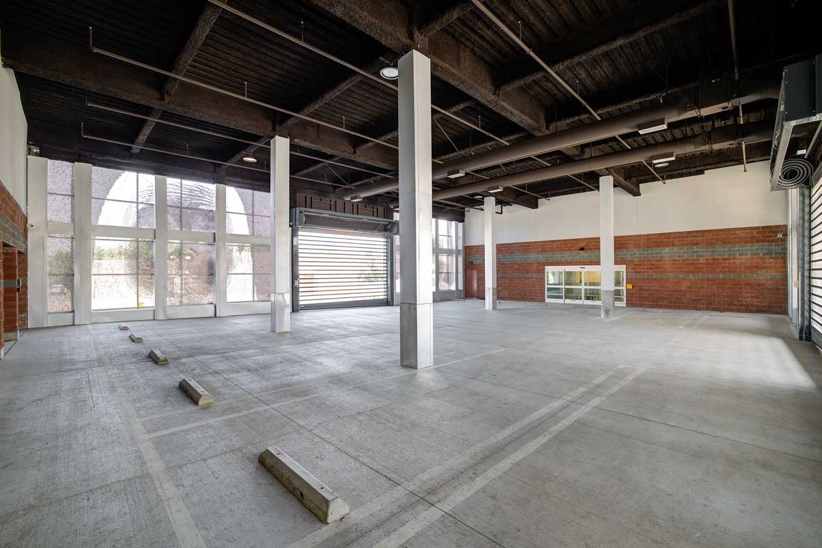 Climate-controlled interior loading area with parking spaces and high ceilings