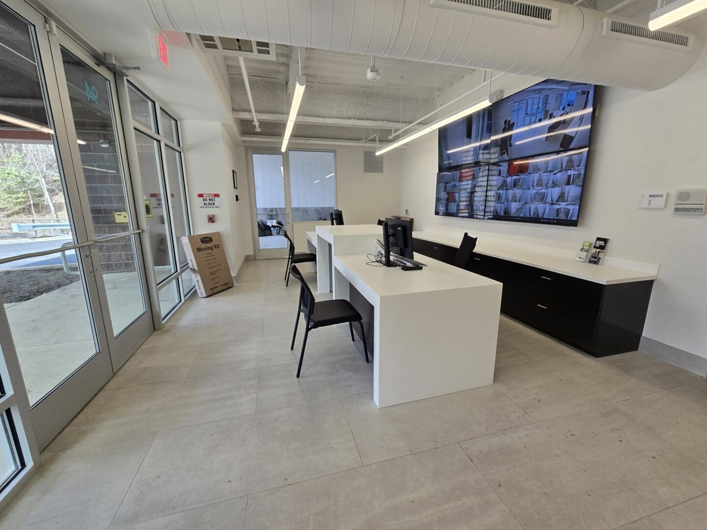 Annapolis Self Storage leasing office photo with video monitors