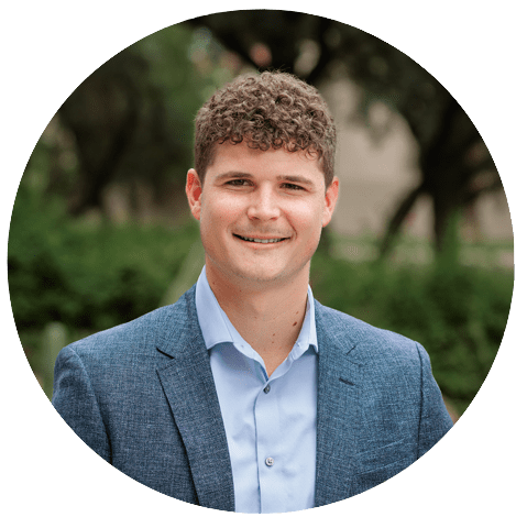 Photo of a professional young man smiling in a suit